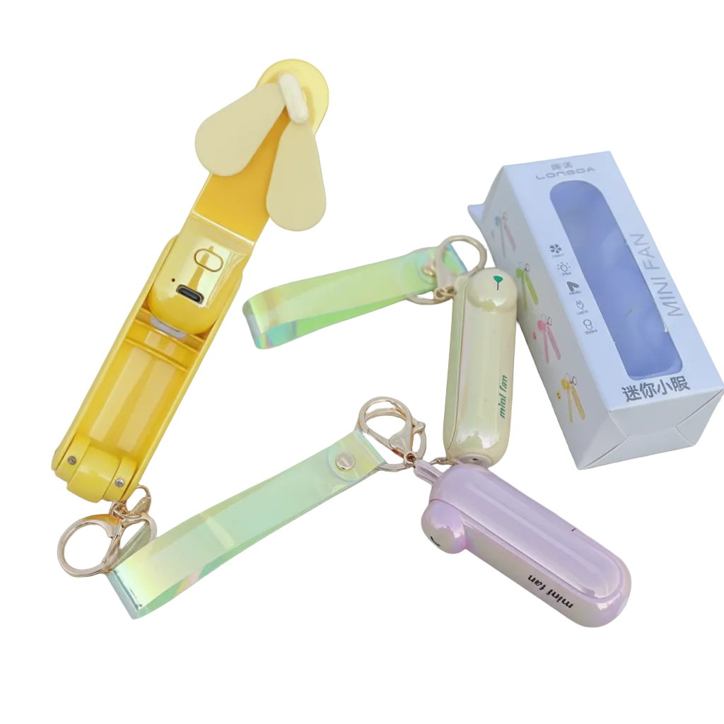 Colorful mini fans with keychains and a box on a white background